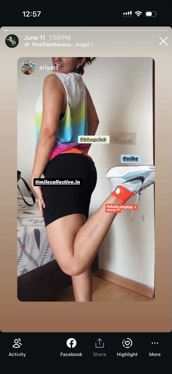 A Story repost of a member in the Bright Aura Vest's rainbow ombre, tagged @bhagclub