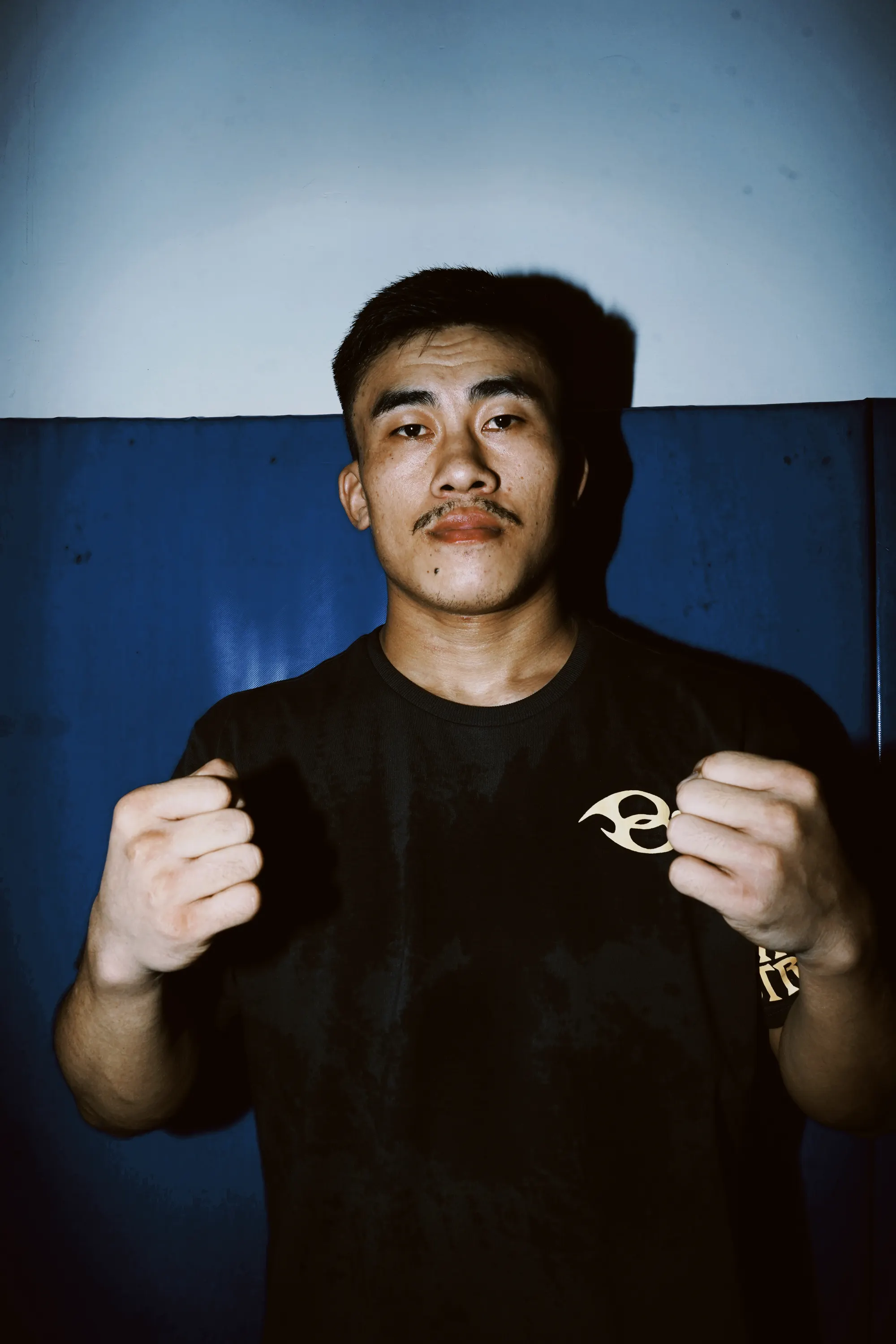 Wild Strides Tee in Ash, front, worn at the Combat Lab