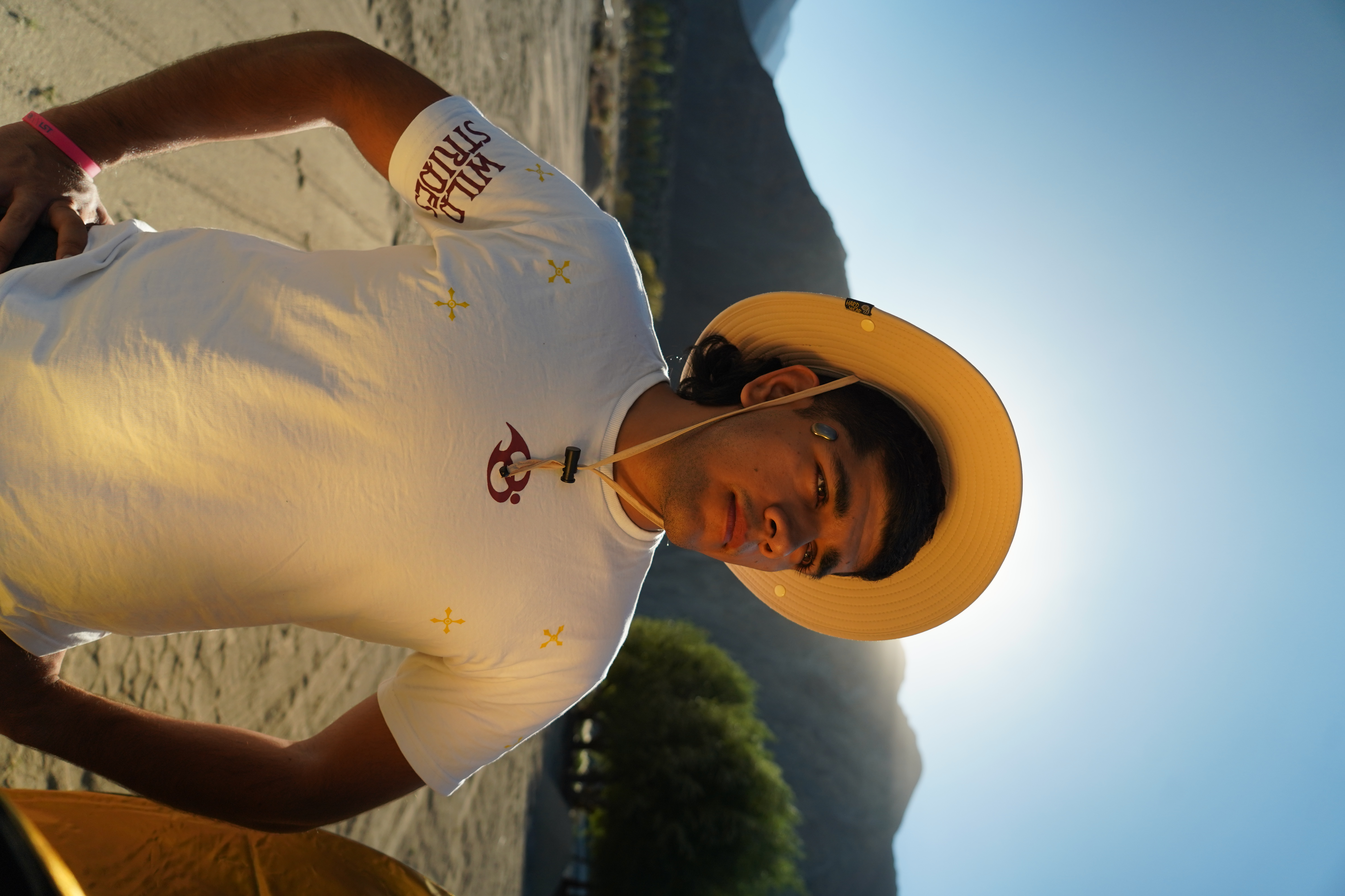 Wild Strides Tee in Ivory, worn - front, out in the desert
