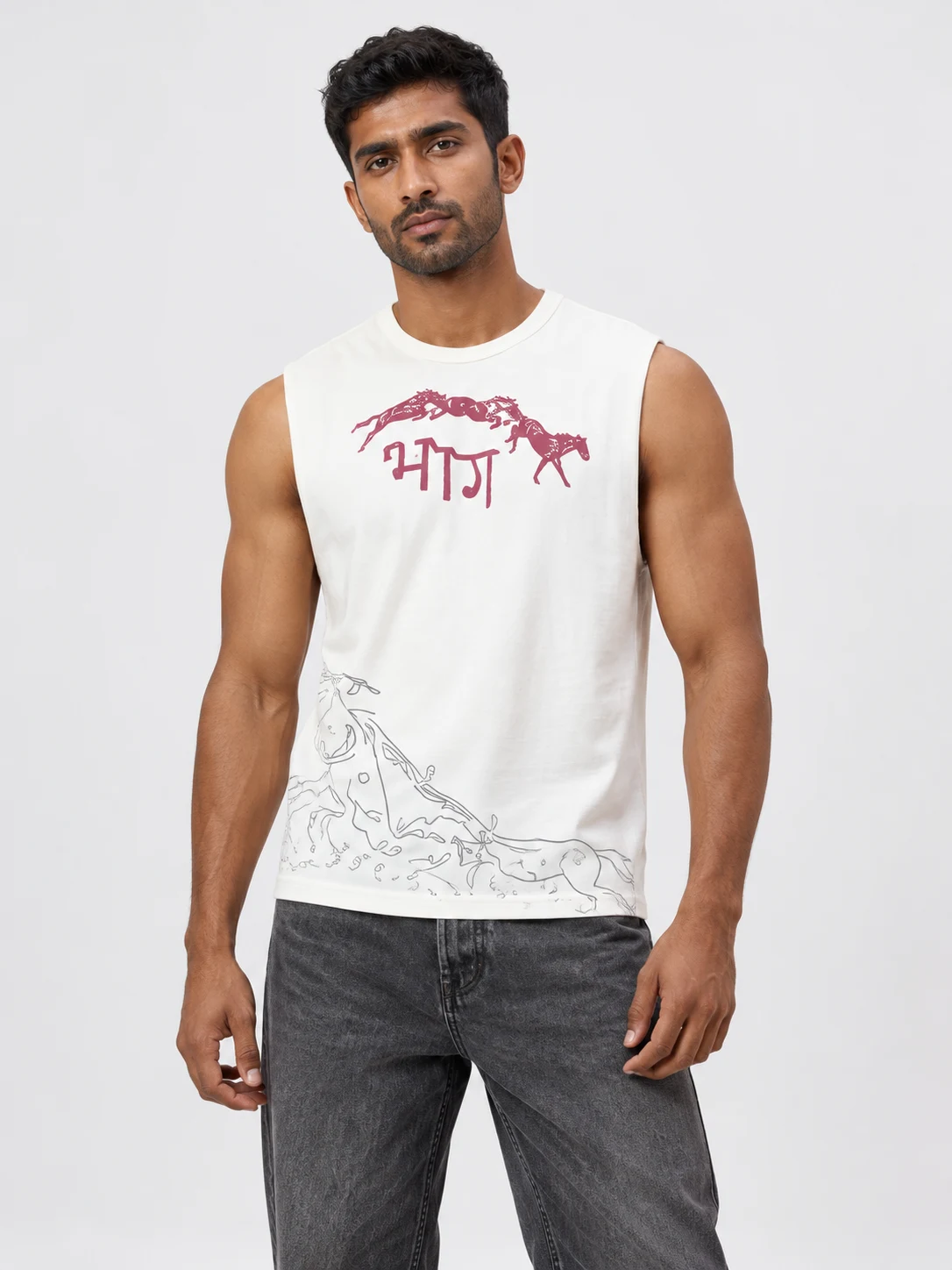 BHAG Muscle Tank in Bone, styled on a model against a soft white-gray studio background