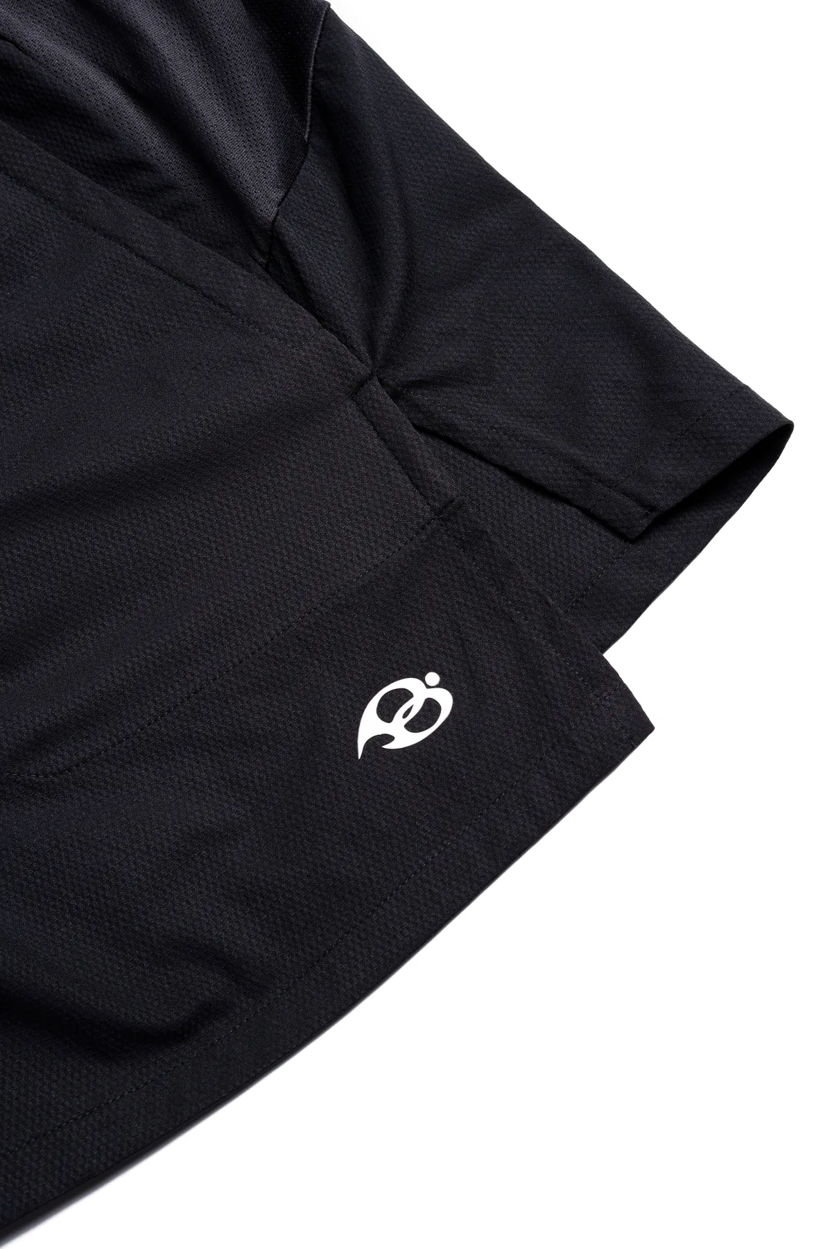 Dark Aura Shorts - the split hem and the mark